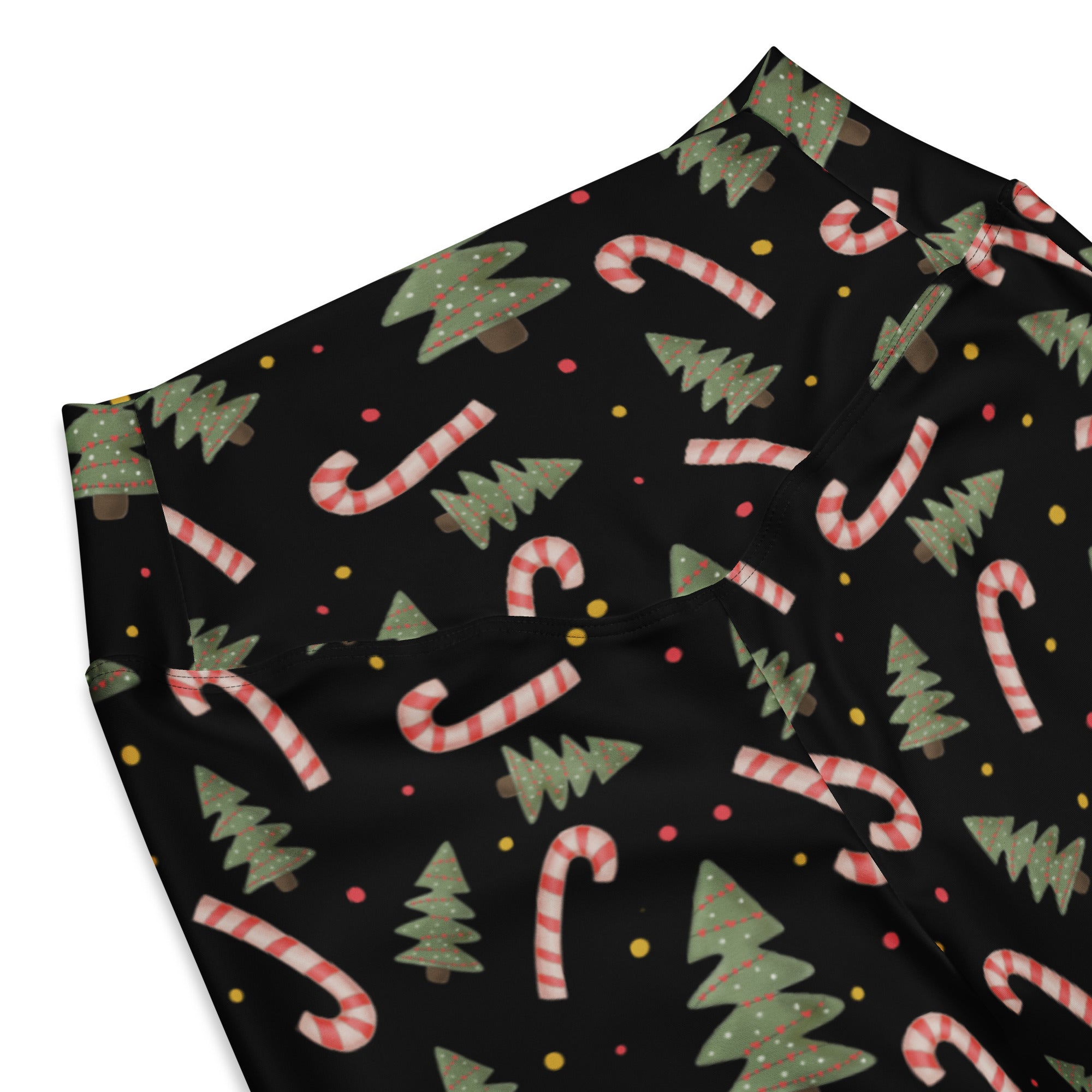 Women’s christmas candy cane high waist flare leggings in black fabric with red white striped candy canes and green pine trees