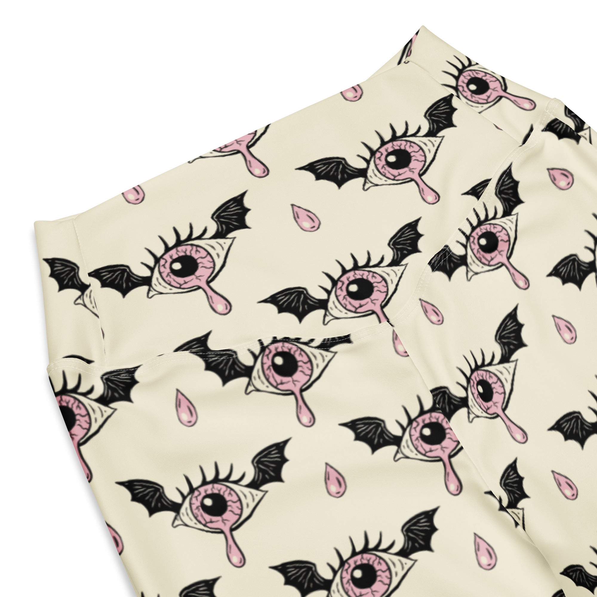 Cream-colored women’s gothic eyeball bat high waist flare leggings with pink eye and bat wing pattern