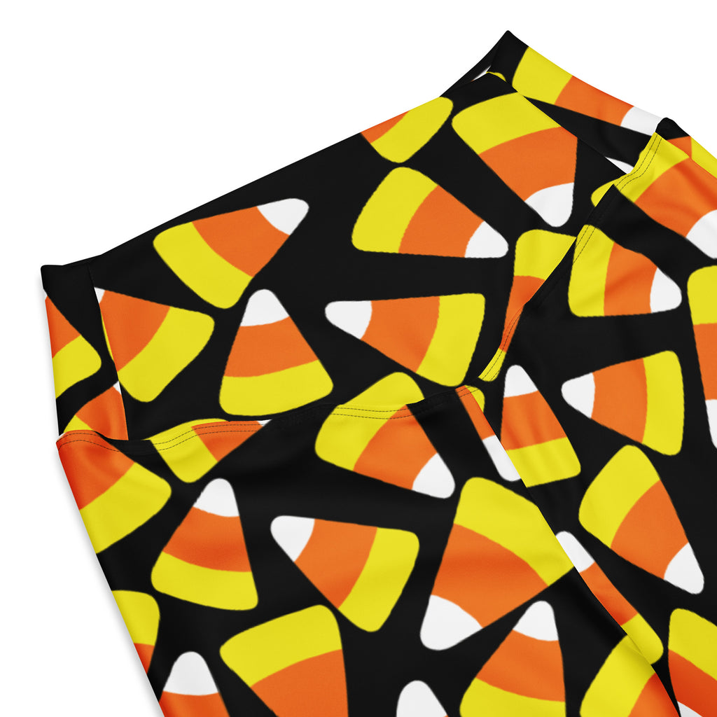 Black women’s high waist flare leggings with vibrant orange yellow and white candy corn pattern