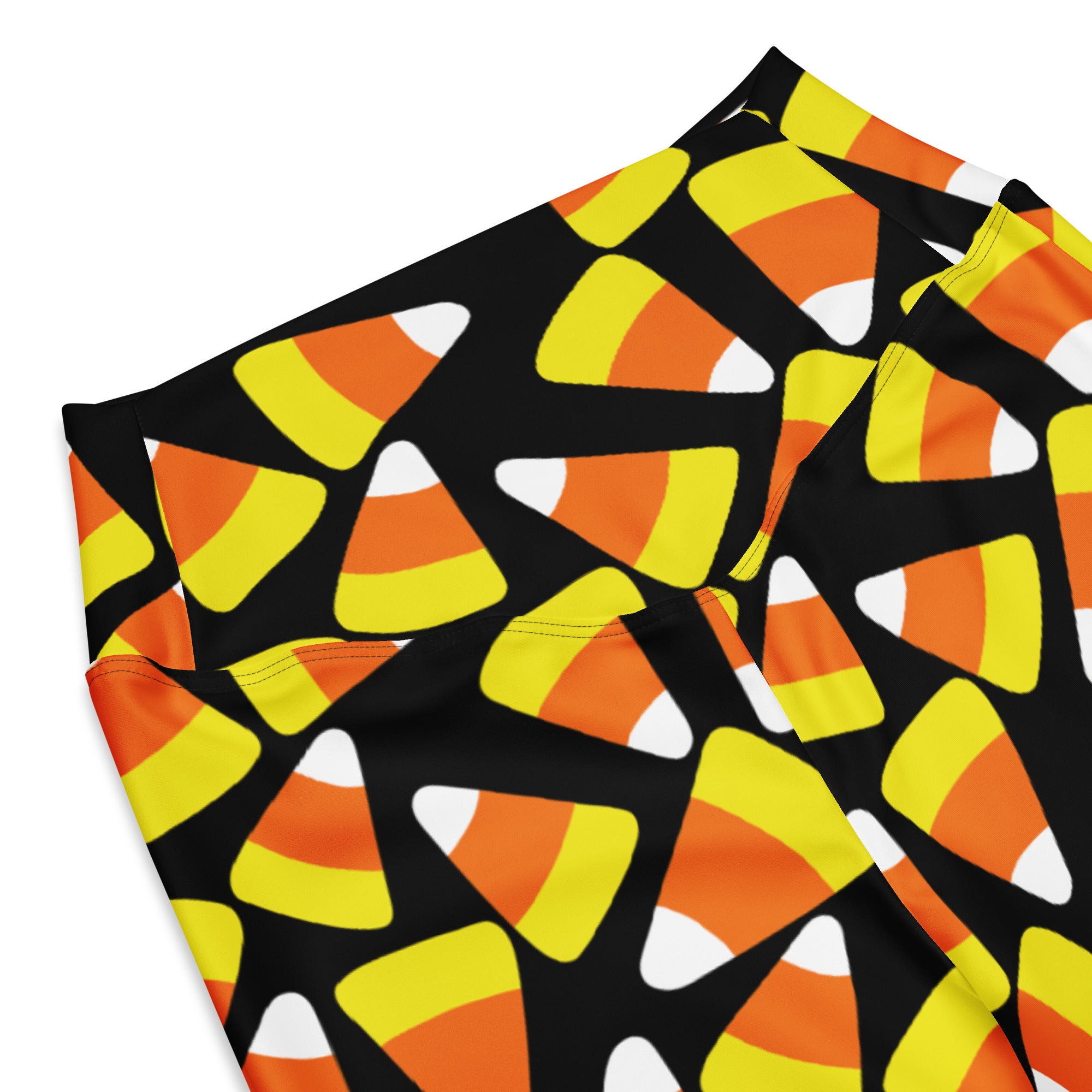 Black women’s high waist flare leggings with vibrant orange yellow and white candy corn pattern