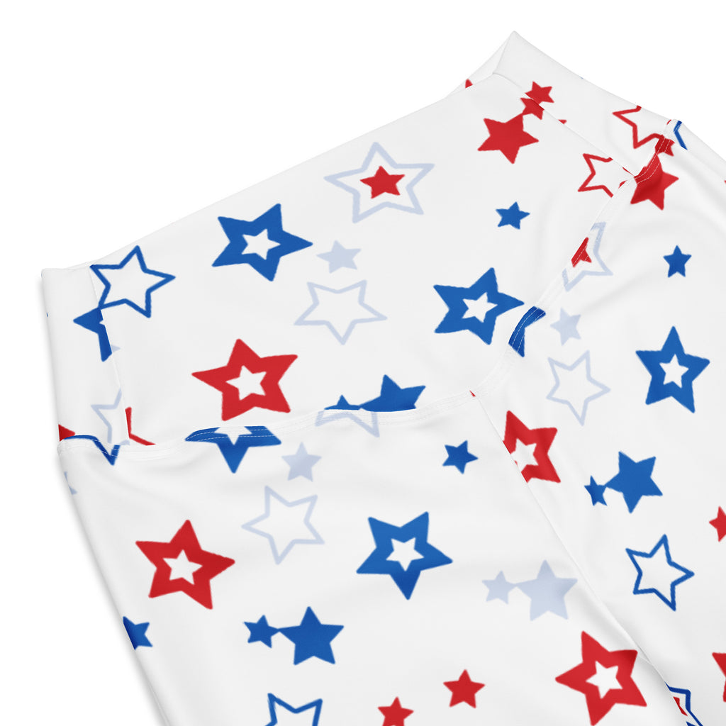 White fabric high waist flare legging pants with playful red blue and light gray star pattern for women