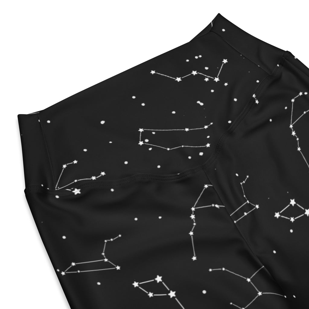 Black fabric women’s realistic constellations high waist flare leggings with a white constellation pattern