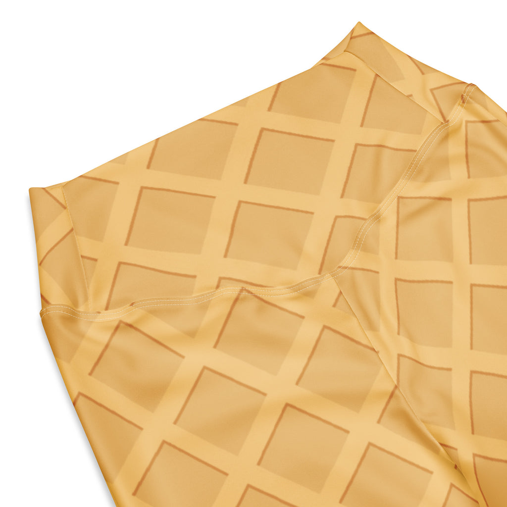 Soft golden-yellow waffle texture fabric of women’s waffle cone high waist flare legging pants closeup