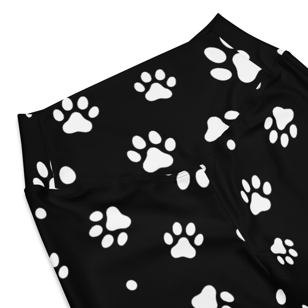 Women’s black high waist flare leggings with white paw print pattern ideal for casual and active wear