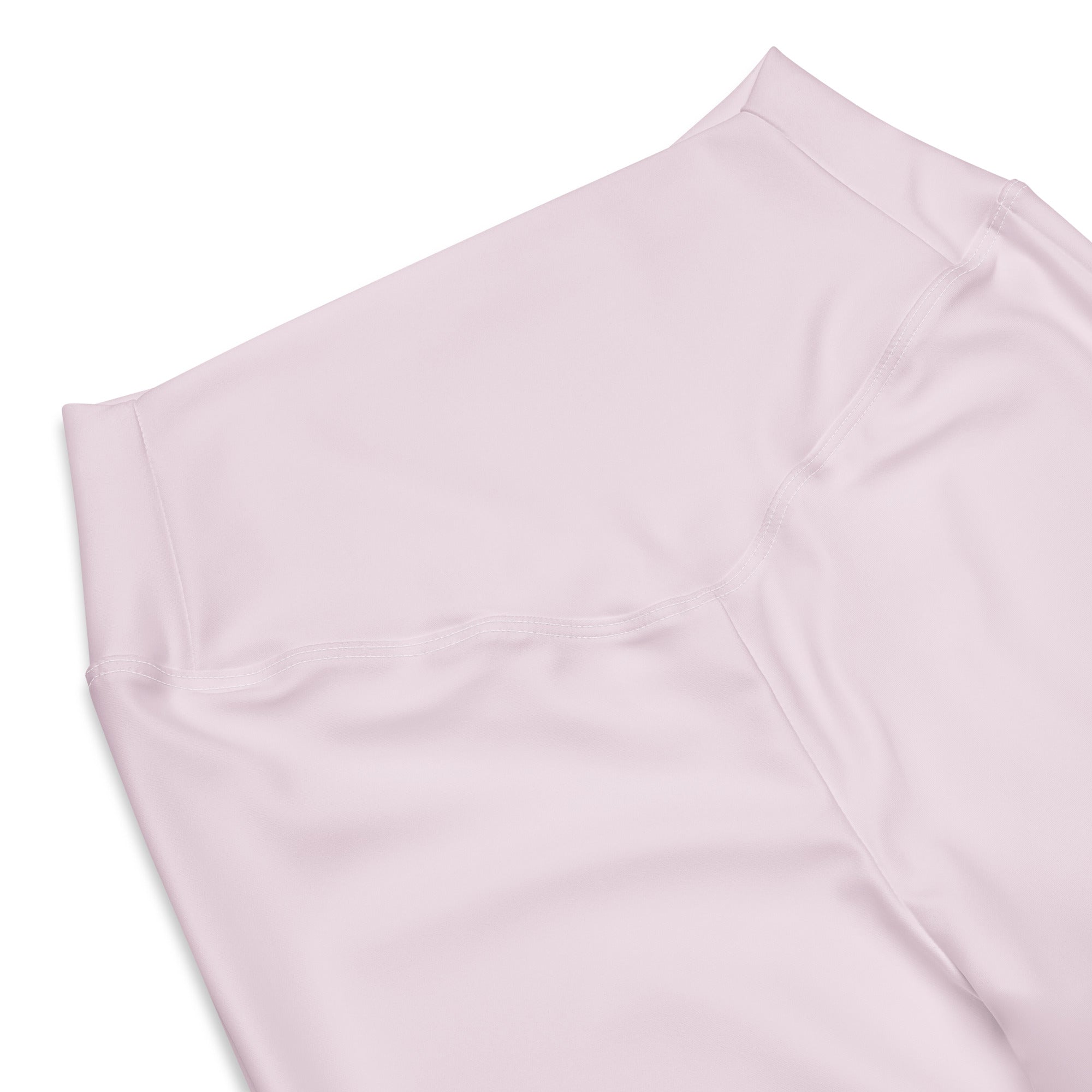A soft blush pink high waist flare legging pant made of smooth stretchy fabric with clean stitching for women