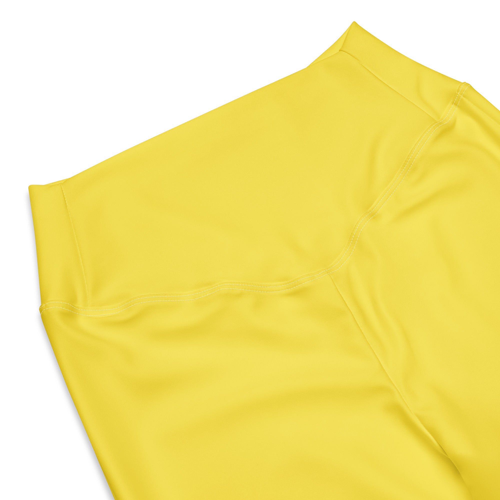 Women’s yellow high waist flare leggings made of smooth stretchy fabric for a comfortable fit
