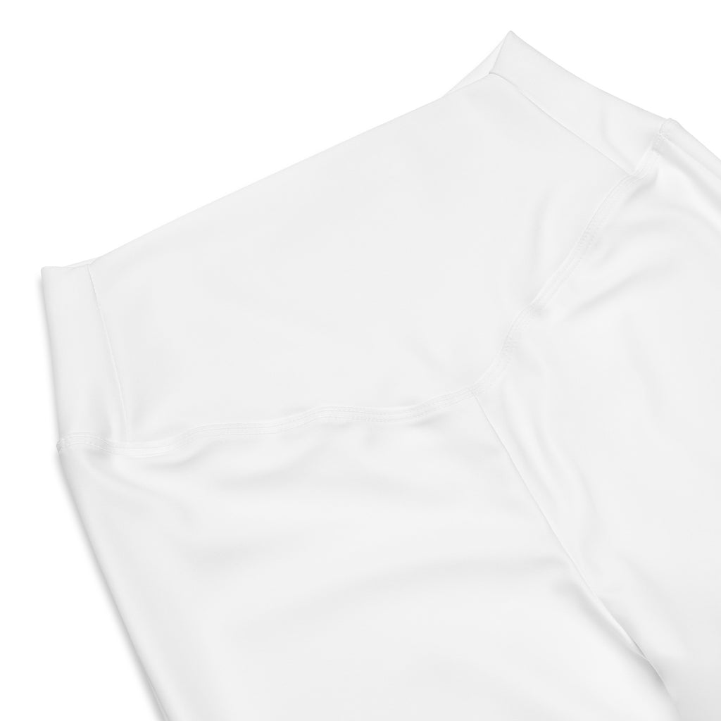 Women’s white high waist flare legging pants made of smooth textured fabric with a minimalist design