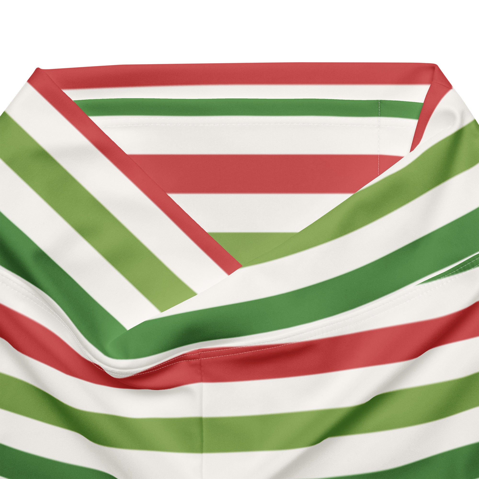 A soft lightweight scarf with bold red white and green diagonal stripes paired with women’s yellow high waist flare leggings