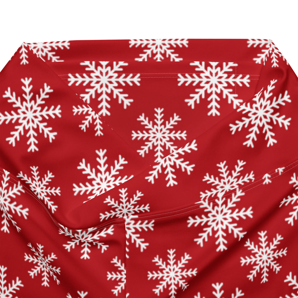 Women’s red high waist flare legging pants with white snowflake pattern on soft fabric for winter wear