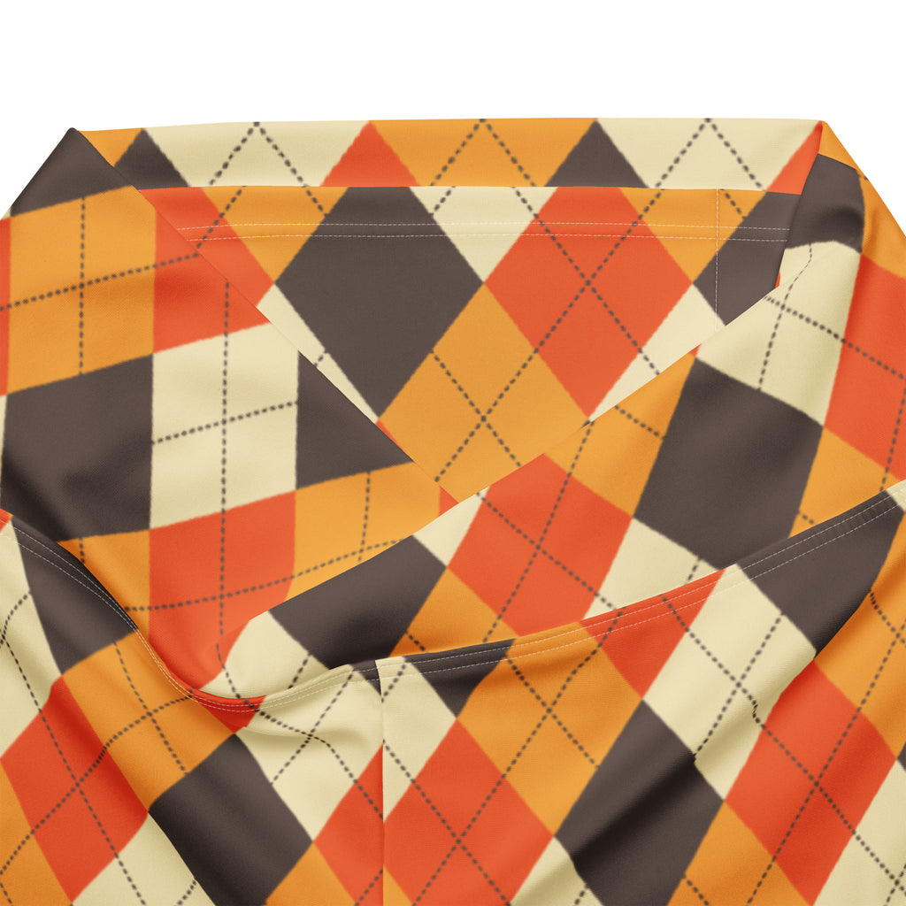 Women’s fall argyle high waist flare legging pants in vibrant orange cream and dark gray fabric with subtle sheen