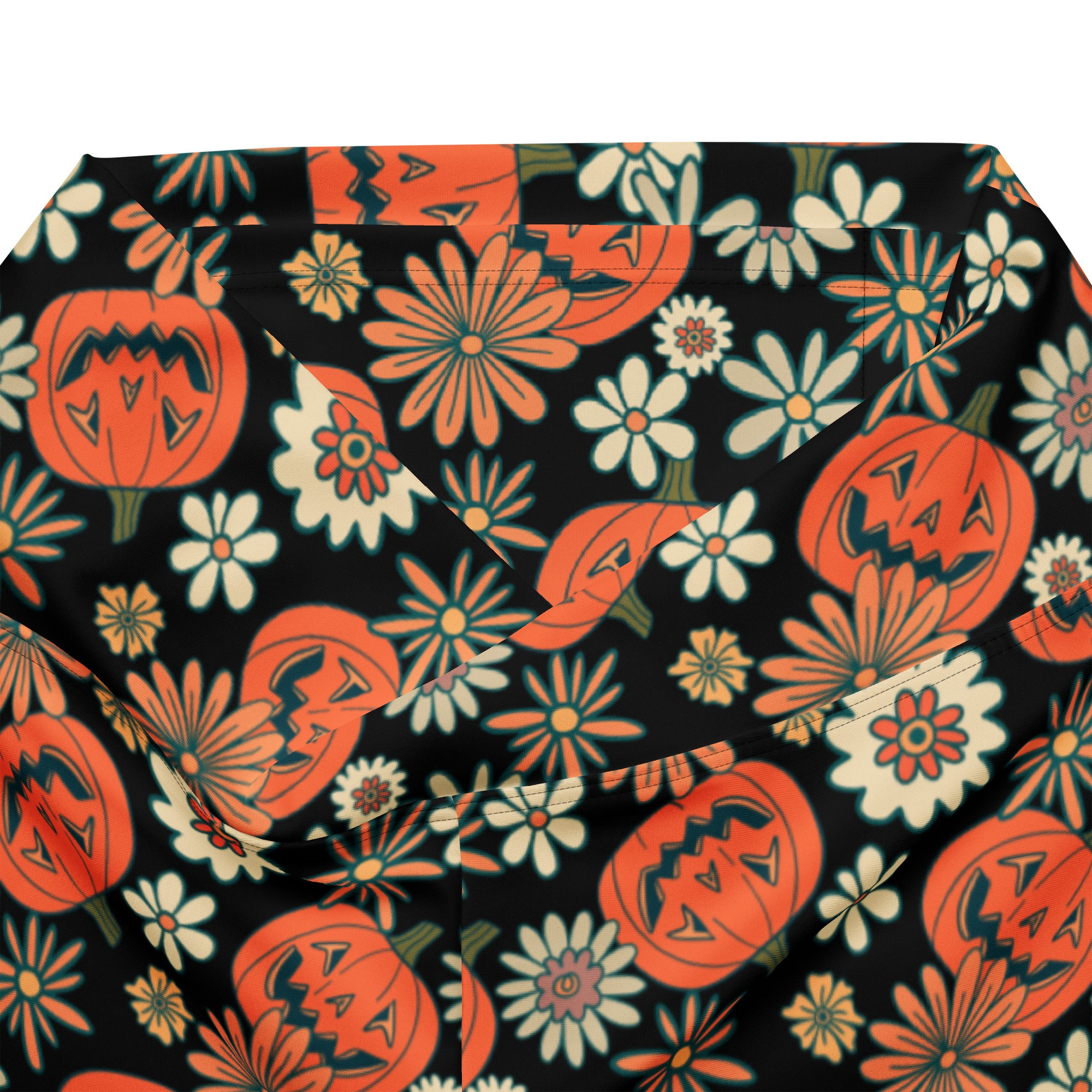 Black women’s retro halloween high waist flare legging pants with orange jack o lanterns and white daisies pattern