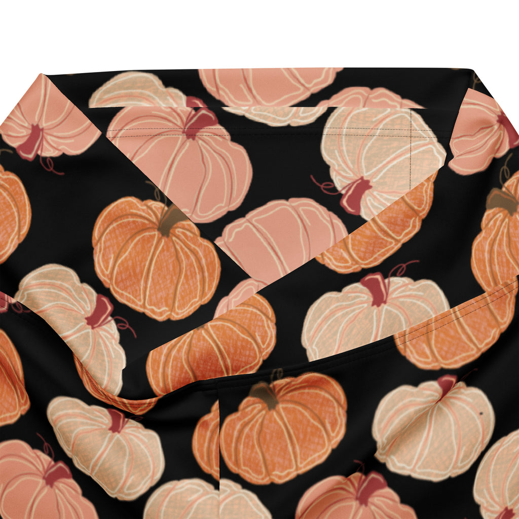 Women’s pumpkin patch high waist flare legging pants in black fabric with orange and peach pumpkin pattern