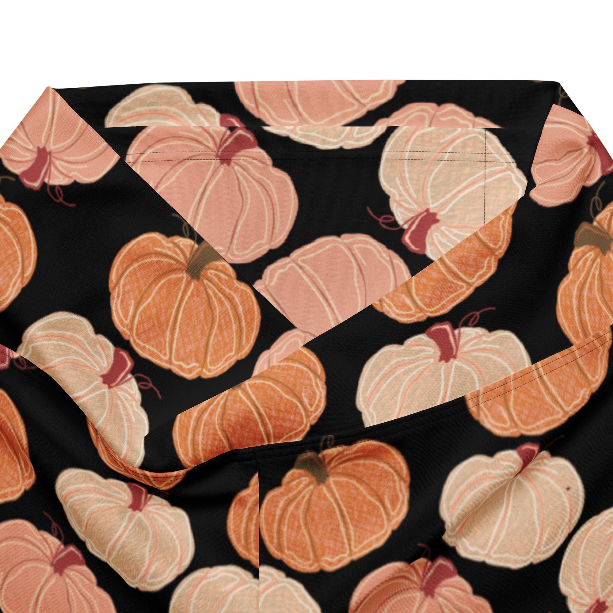 Women’s pumpkin patch high waist flare legging pants in black fabric with orange and peach pumpkin pattern