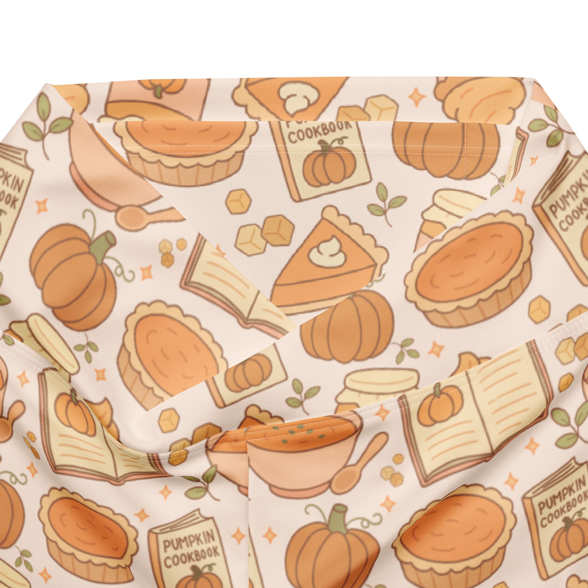 Women’s pumpkin pie themed high waist flare leggings in soft cream fabric with playful pumpkin and cookbook illustrations