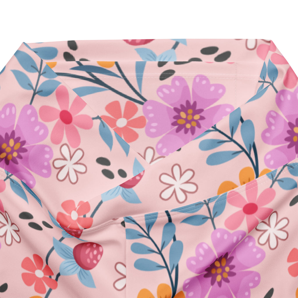 Women’s pink floral high waist flare legging pants with vibrant purple pink blue flowers and green leaves pattern