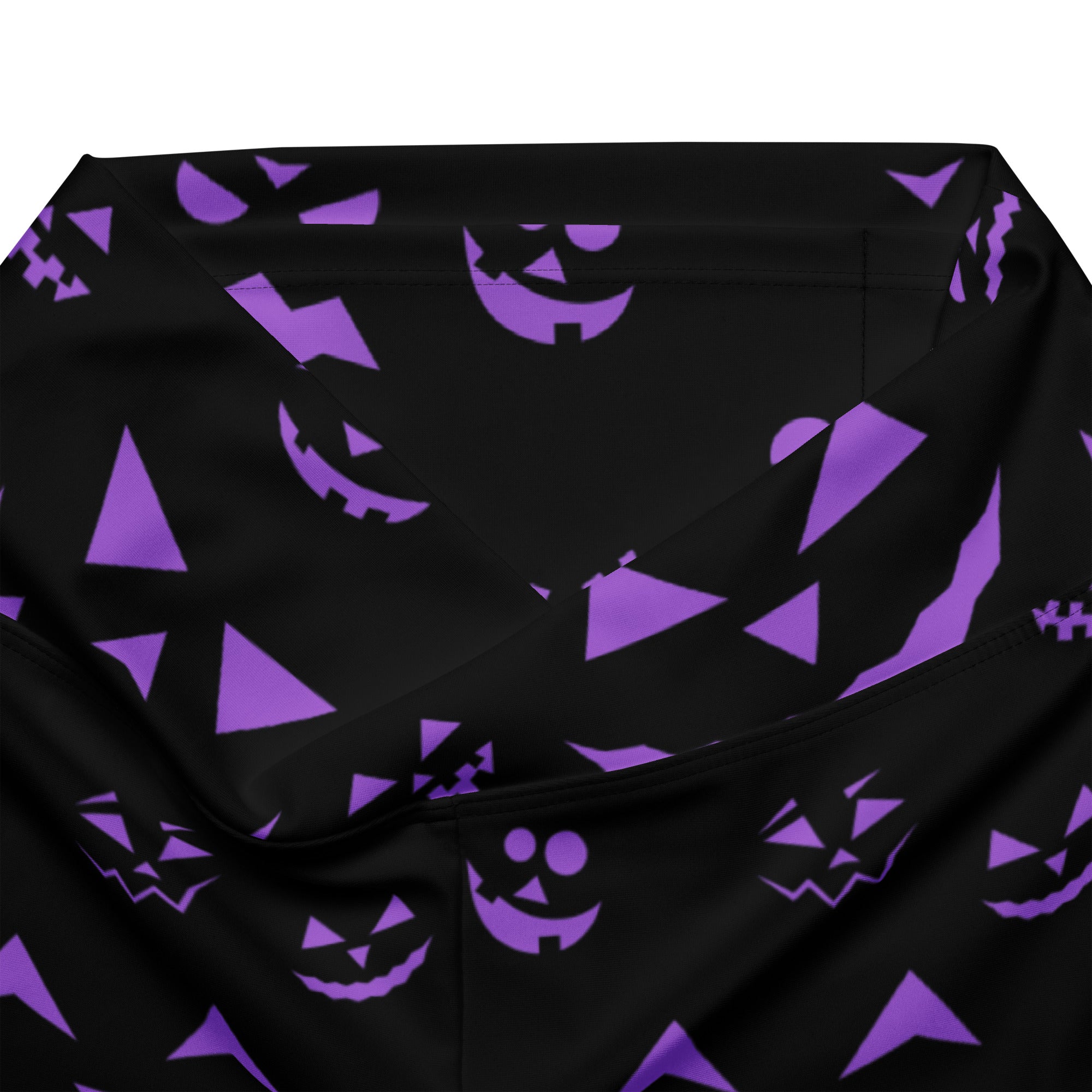 Women’s purple jack o lantern high waist flare legging pants with black fabric and repeating purple pumpkin pattern