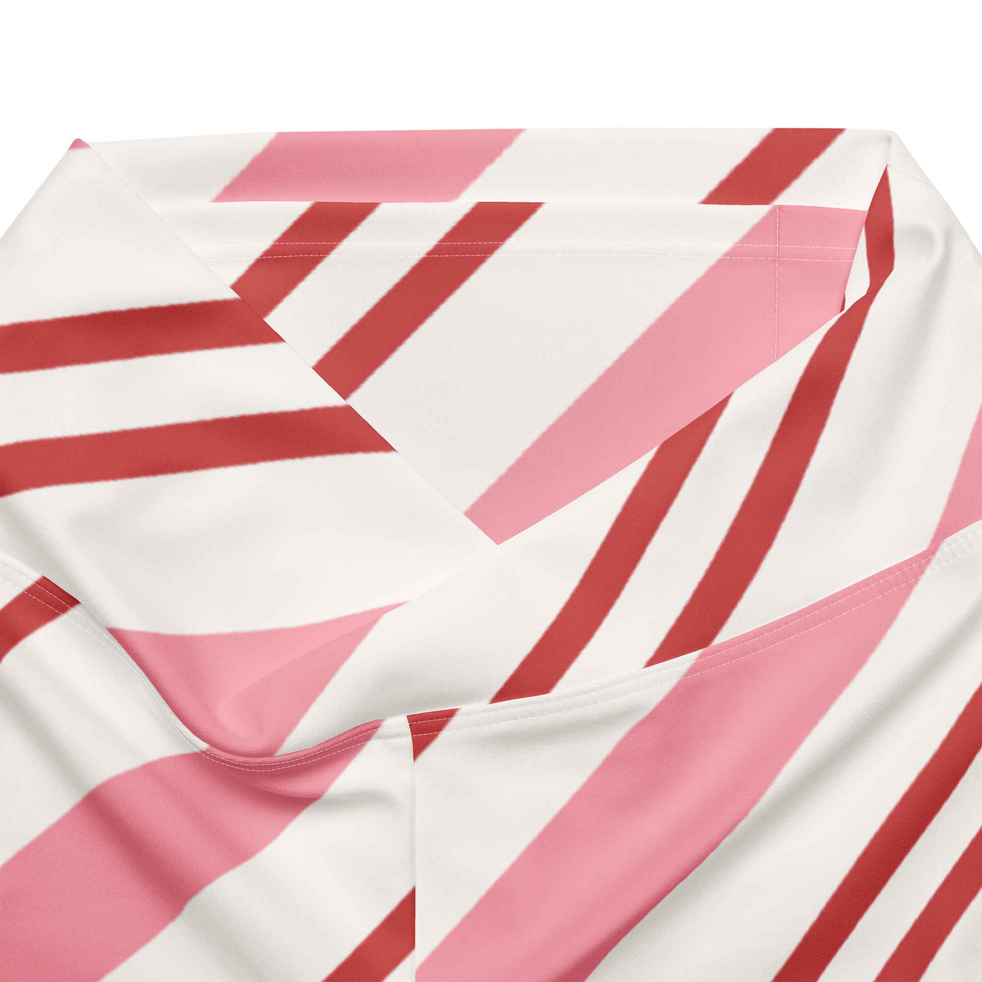 Women’s pink candy cane stripes high waist flare legging pants with bold diagonal pink and deep red stripes on soft white fabric