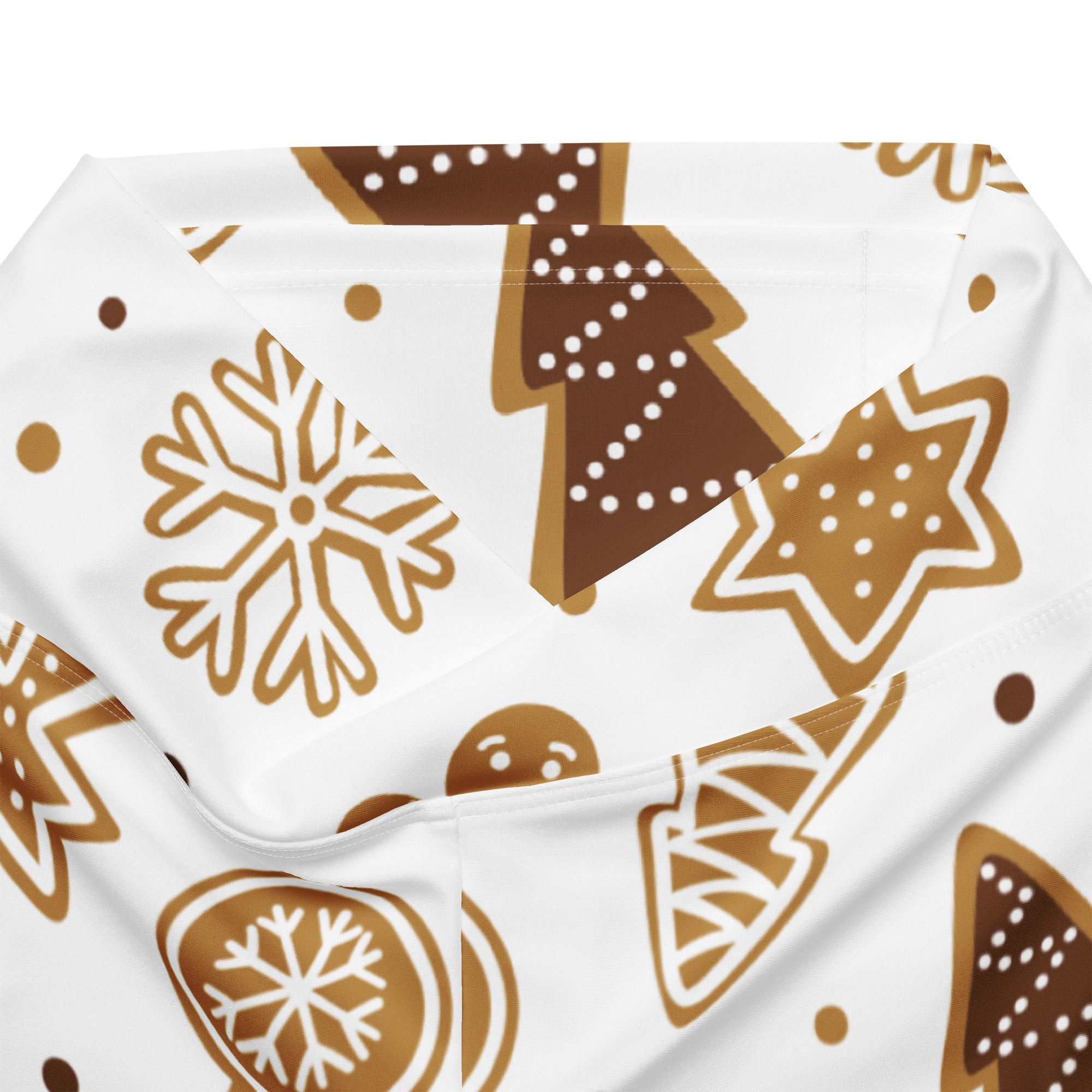 White fabric with festive brown gingerbread cookies snowflakes and stars on women’s christmas high waist flare leggings