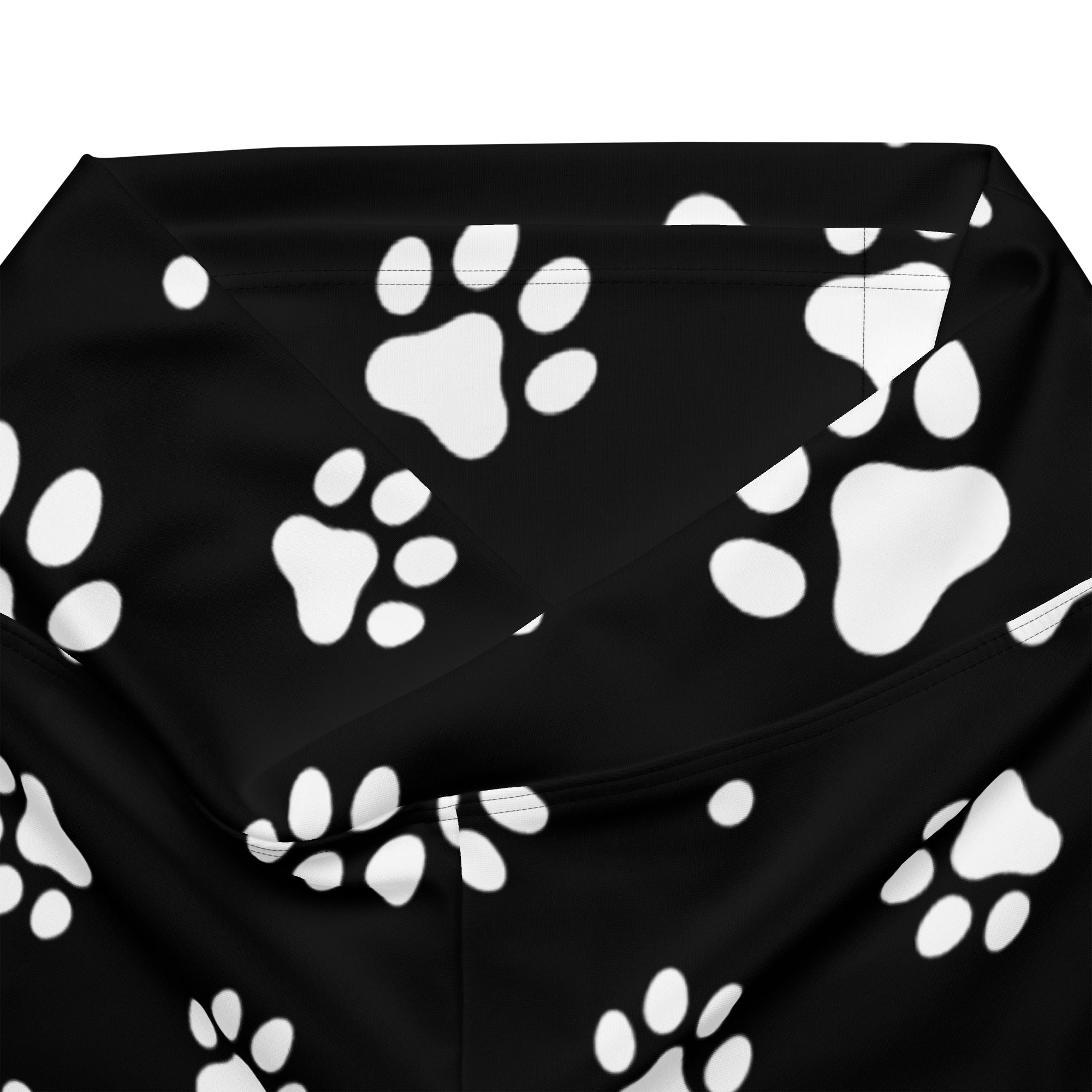 Black fabric bandana with white paw print pattern complementing women’s black paw print high waist flare legging pants