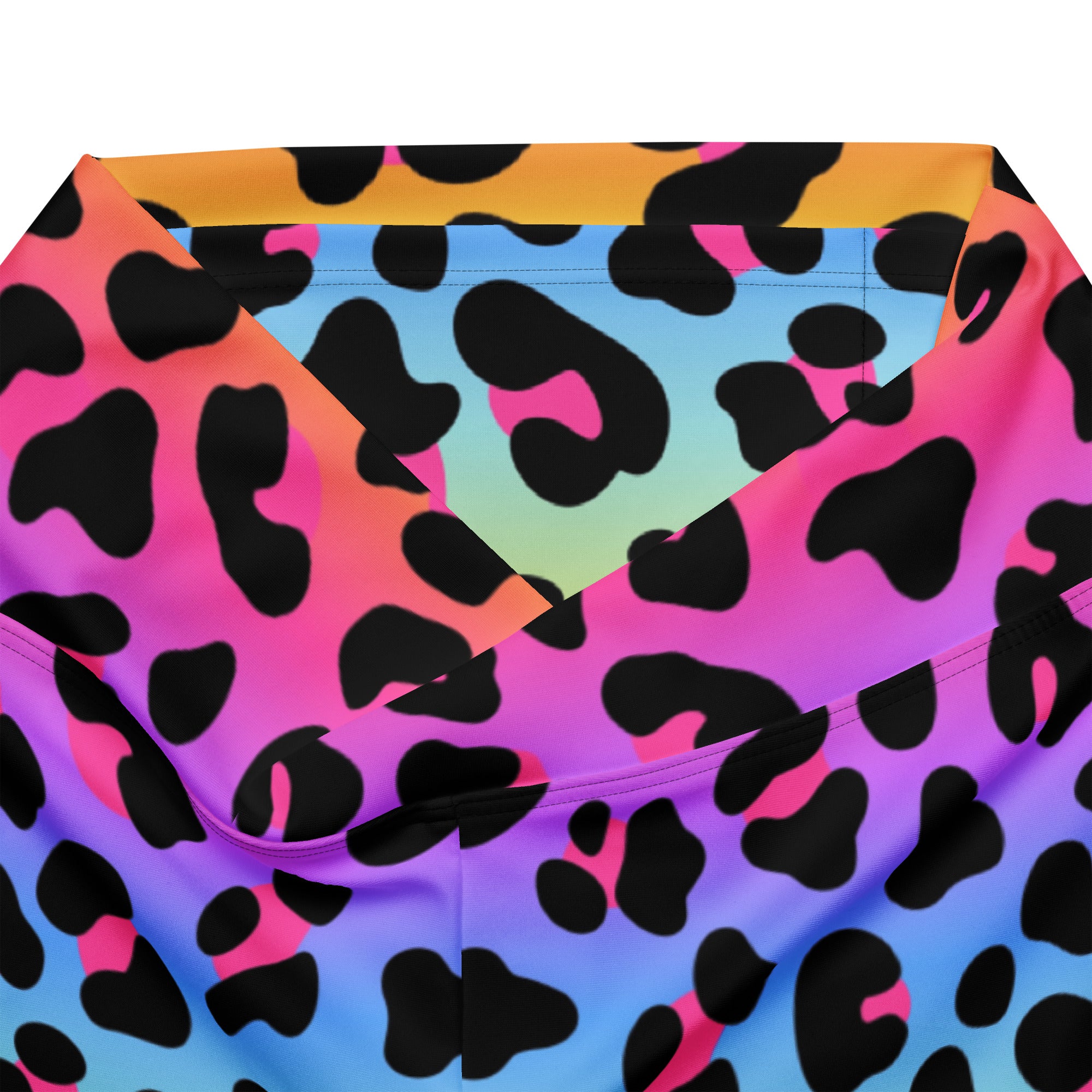 Women’s rainbow leopard high waist flare legging pants with vibrant neon leopard print in pink purple blue and orange hues