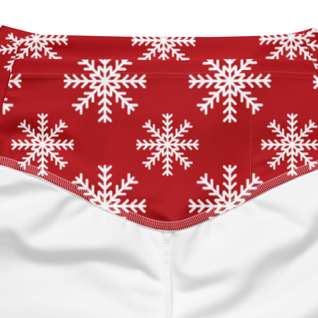 Women’s red high waist flare legging pants with white snowflake pattern on soft fabric for winter wear