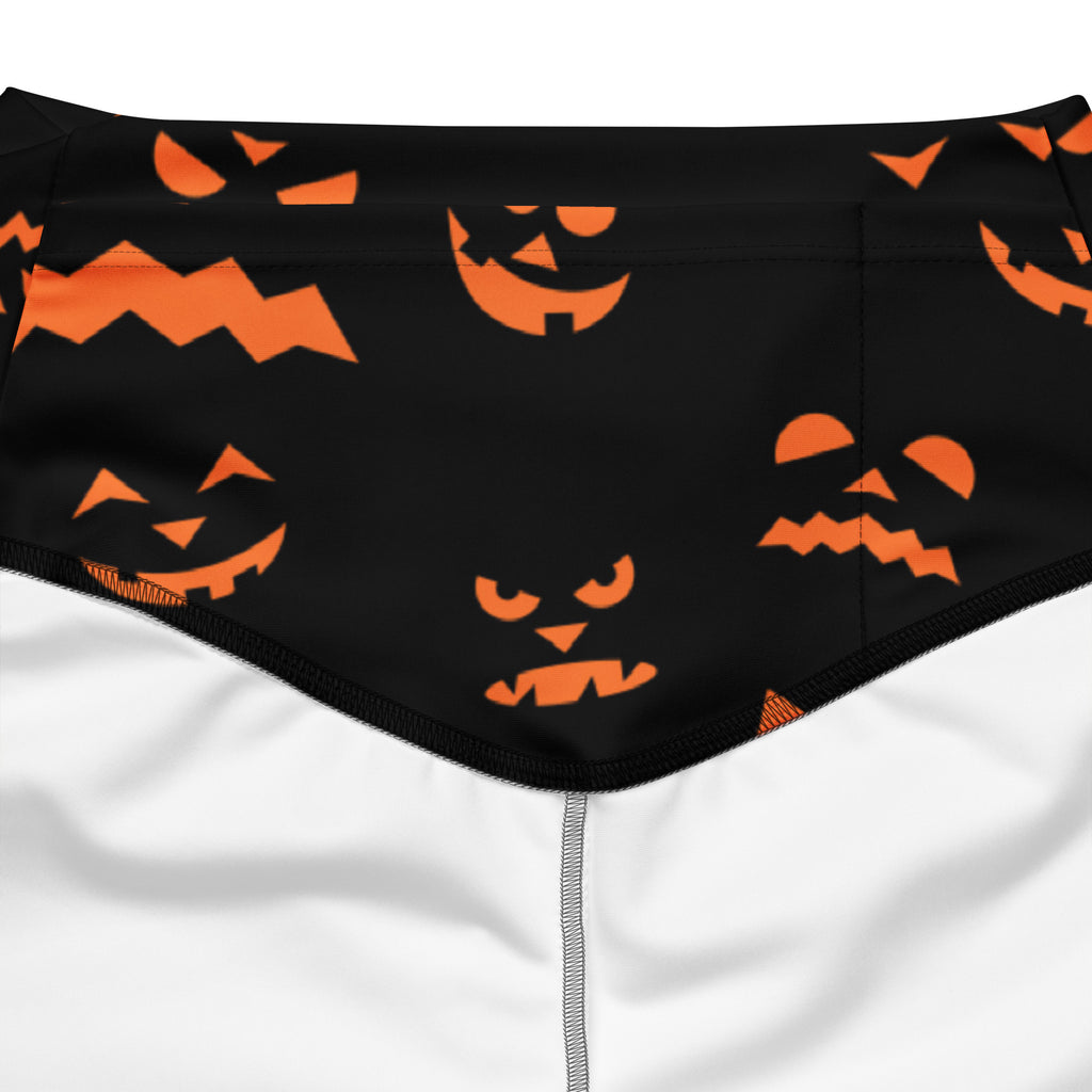 Black swim trunks with a playful orange jack-o-lantern pattern for halloween swimwear