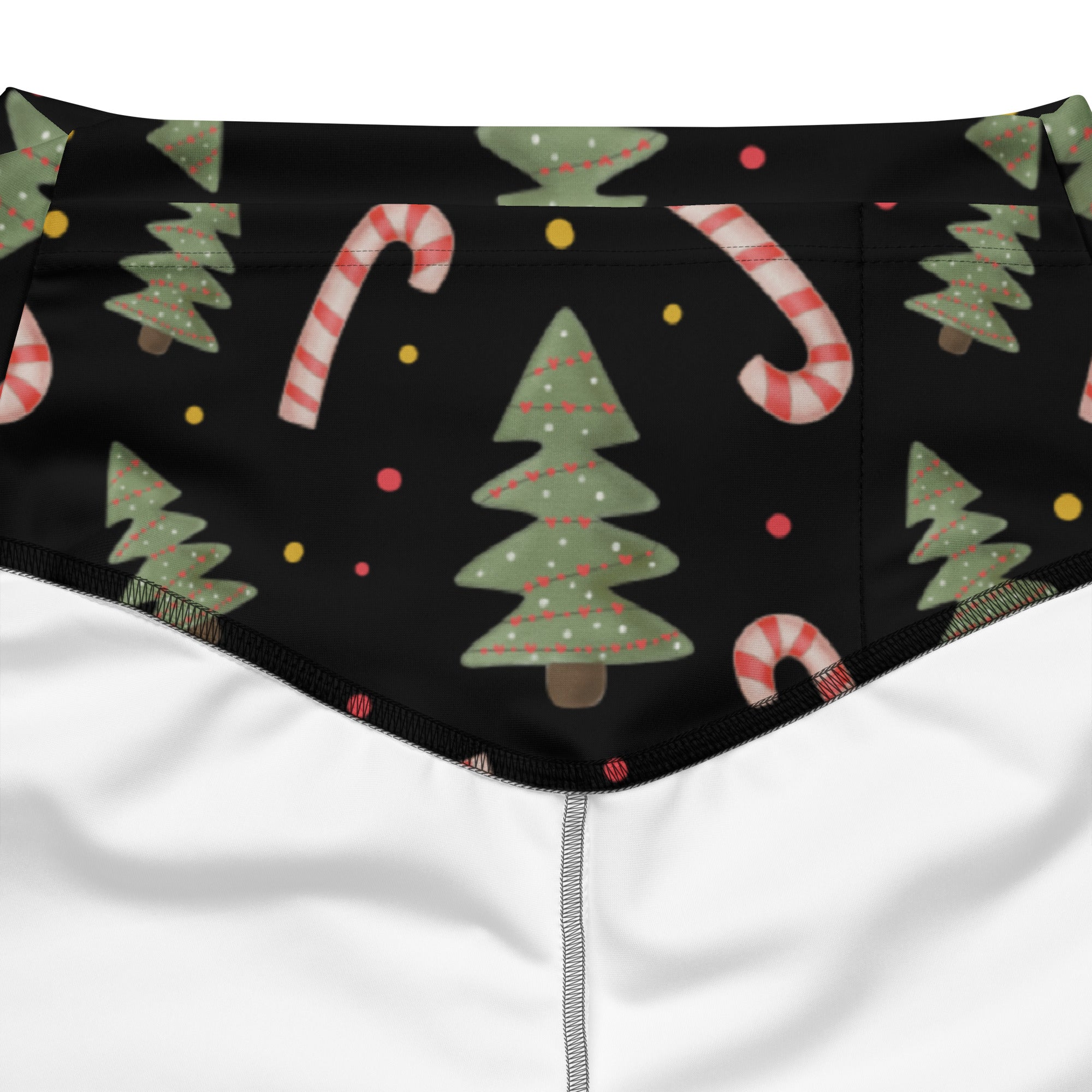 Women’s christmas candy cane high waist flare legging pants with black fabric green pine trees and red white candy canes