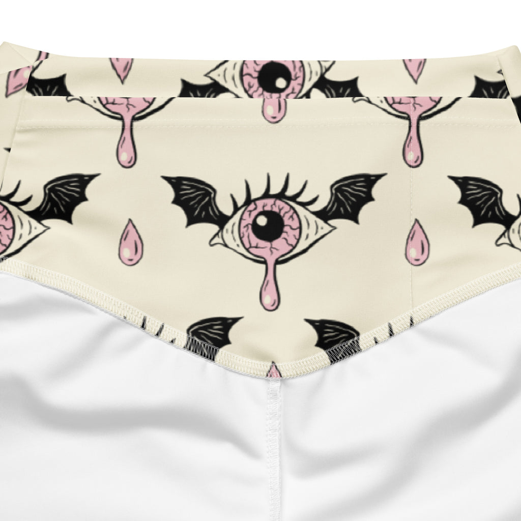 Cream-colored bandana with pink eyeball designs, black bat wings, and droplets for women’s gothic flare leggings