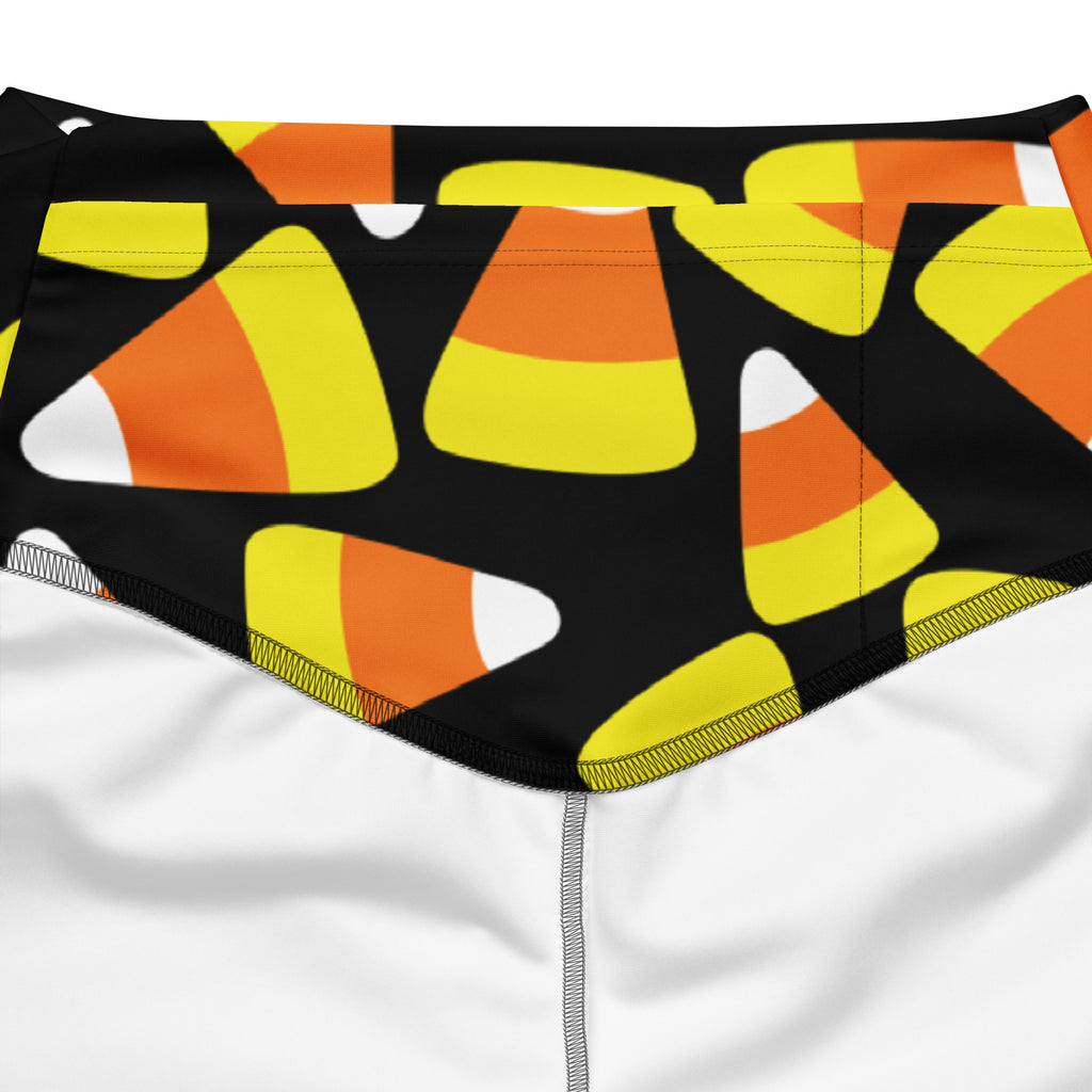 Women’s black swim trunks with vibrant orange yellow and white candy corn pattern high waist design