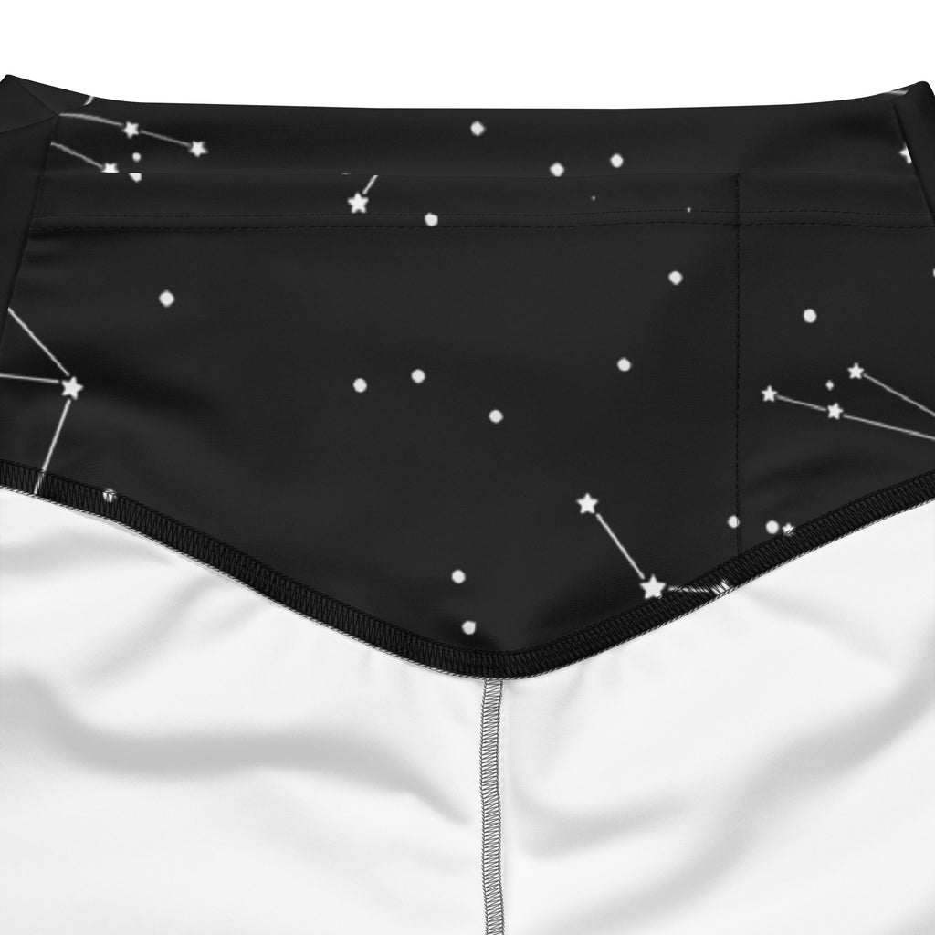 Black high waist flare legging pants with realistic white constellation pattern for women shown from the back