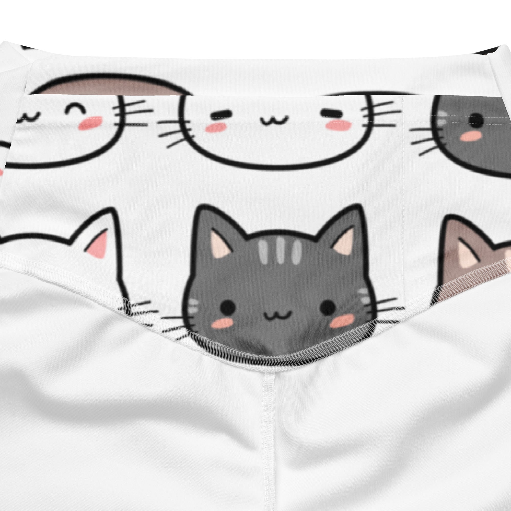 White fabric face mask with playful gray black and brown cartoon cats and pink cheeks for women’s cute cat print leggings