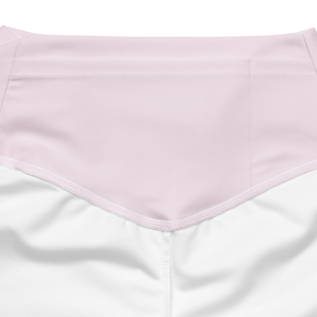 A soft pink high waist flare legging pant made from smooth fabric with neatly stitched edges for women