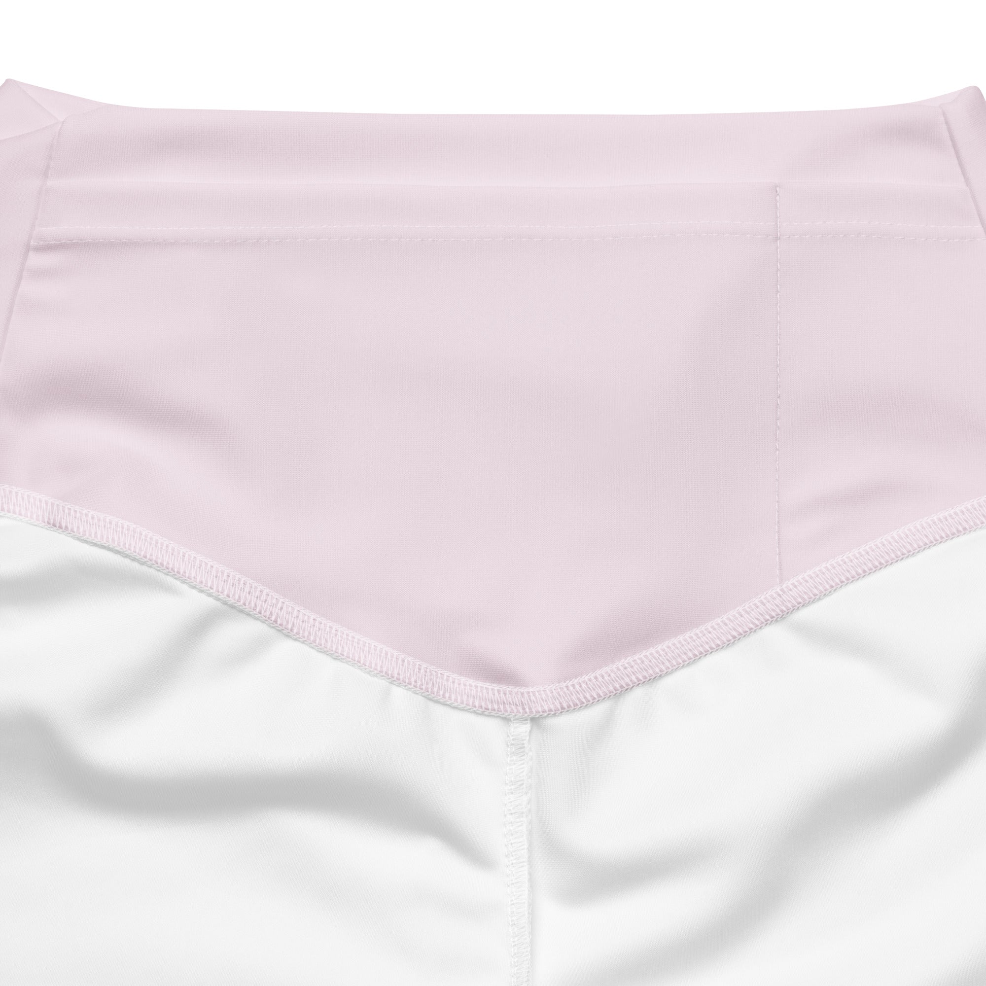 A soft pink high waist flare legging pant made from smooth fabric with neatly stitched edges for women