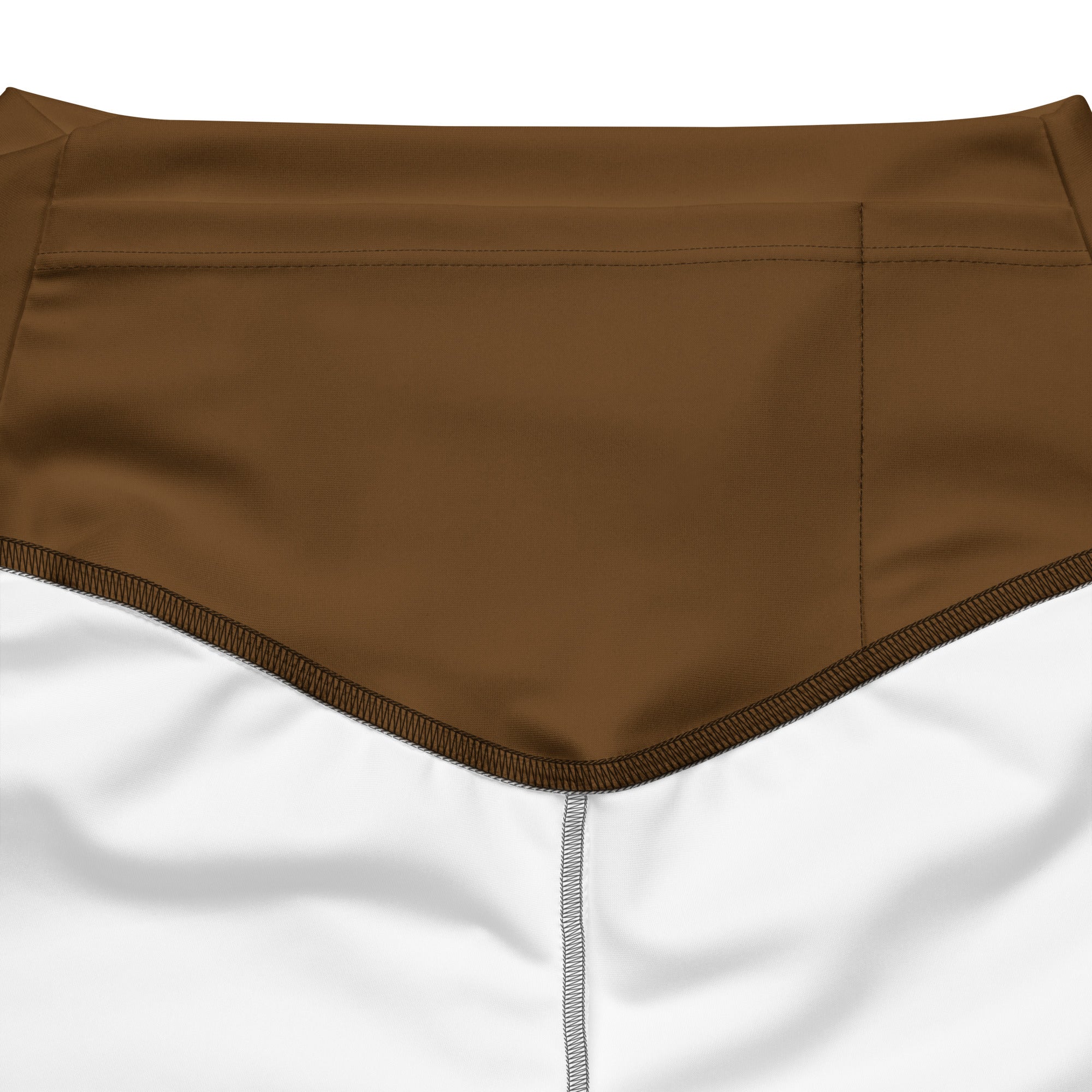 Women’s brown high waist flare legging pants with white athletic fabric, reinforced stitching, and subtle seam detail