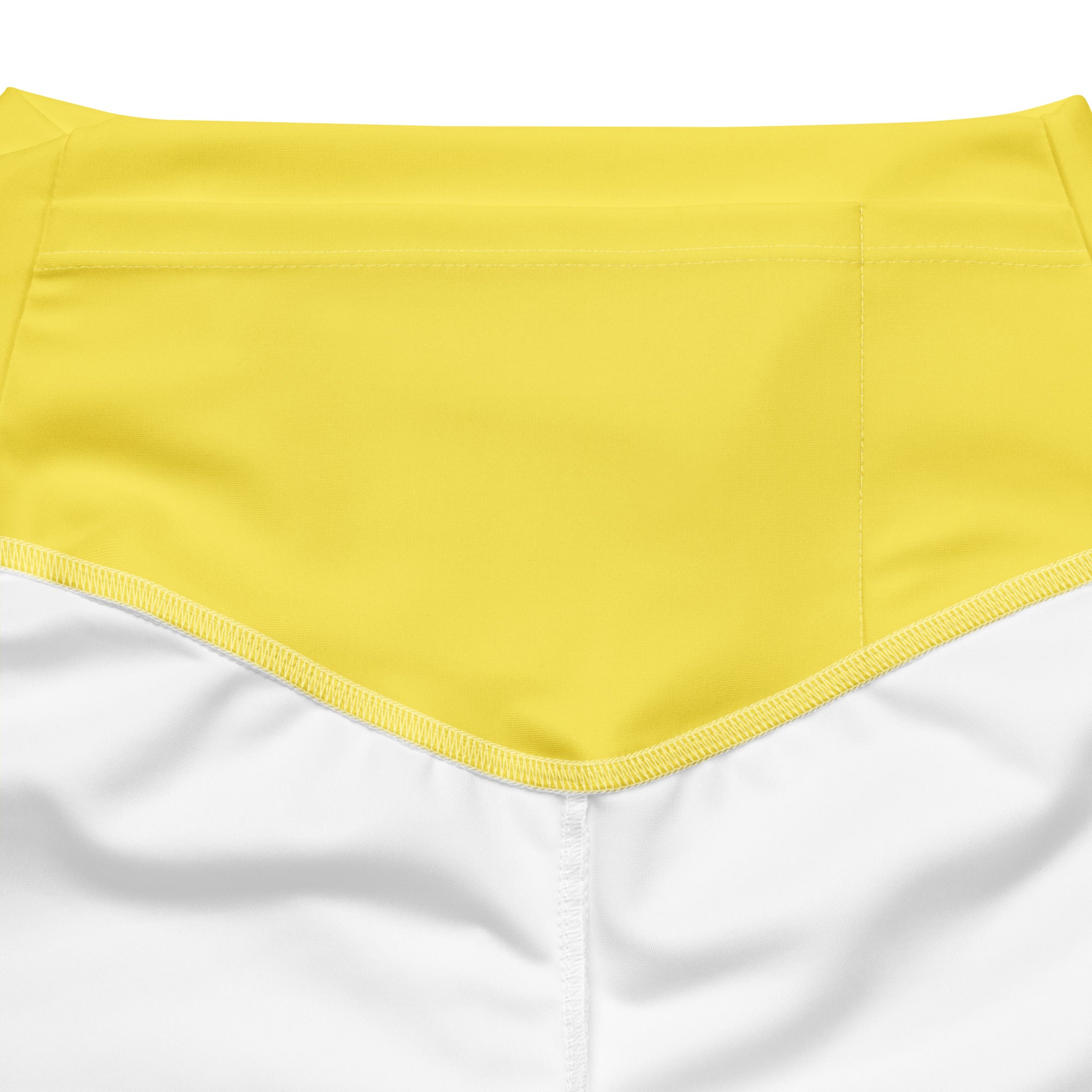 Bright yellow high-waisted bikini bottom with smooth stretchy fabric and clean white stitching along the hem