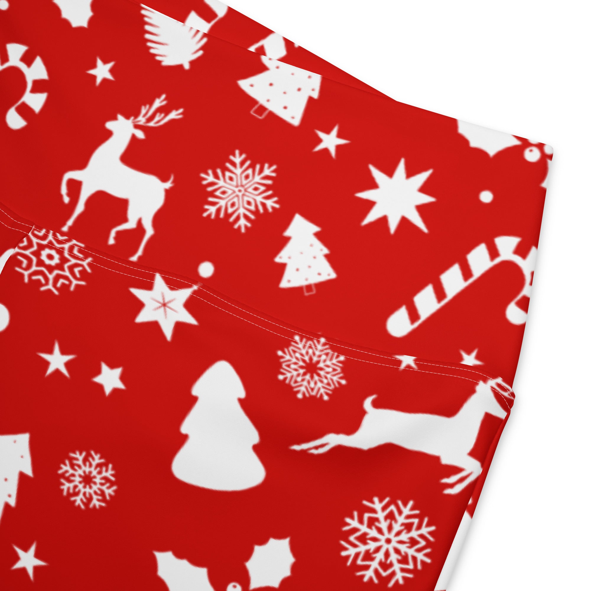 Women’s red high waist flare legging pants with white christmas-themed reindeer snowflakes trees and candy canes pattern