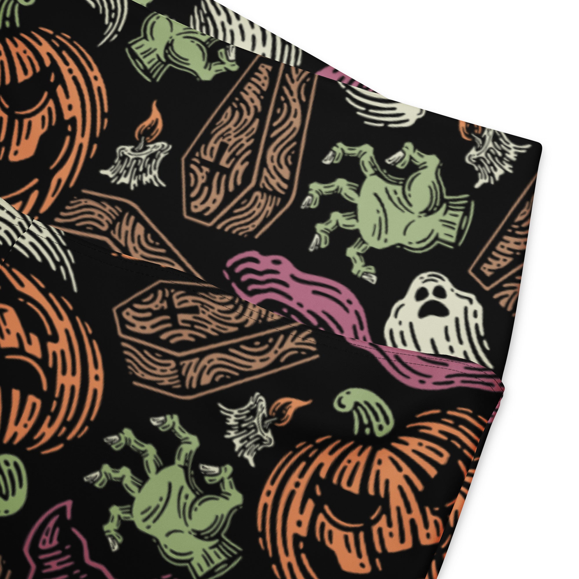 Women’s creepy halloween high waist flare legging pants in black fabric with orange pumpkins green ghosts and wooden coffins pattern
