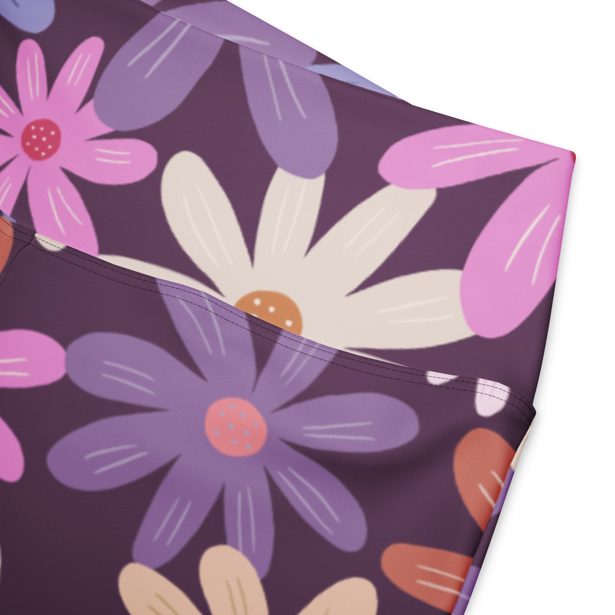 Women’s retro purple daisy high waist flare leggings with pink white and beige floral patterns on dark purple background