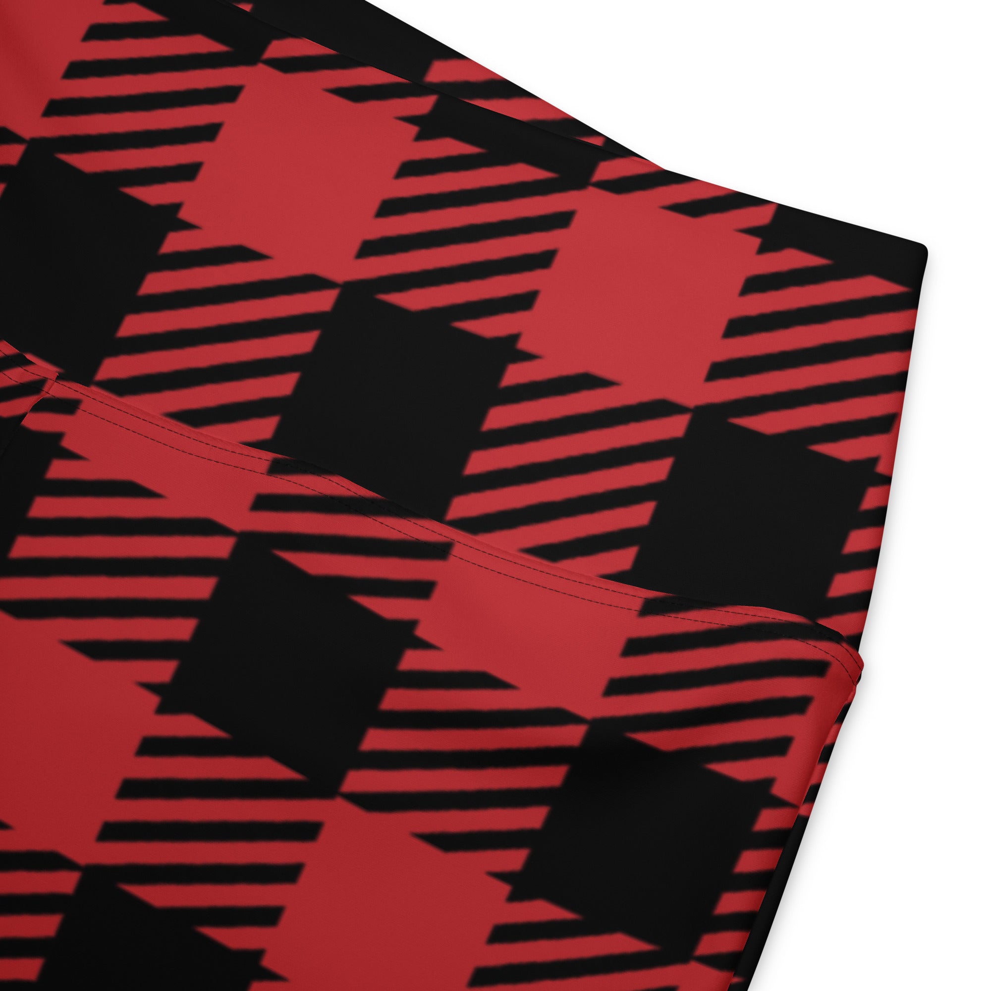 Women’s red buffalo plaid high waist flare leggings with bold black striped houndstooth pattern