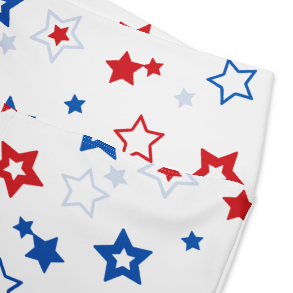 White high waist flare legging pants with playful red blue and light gray star pattern on fabric