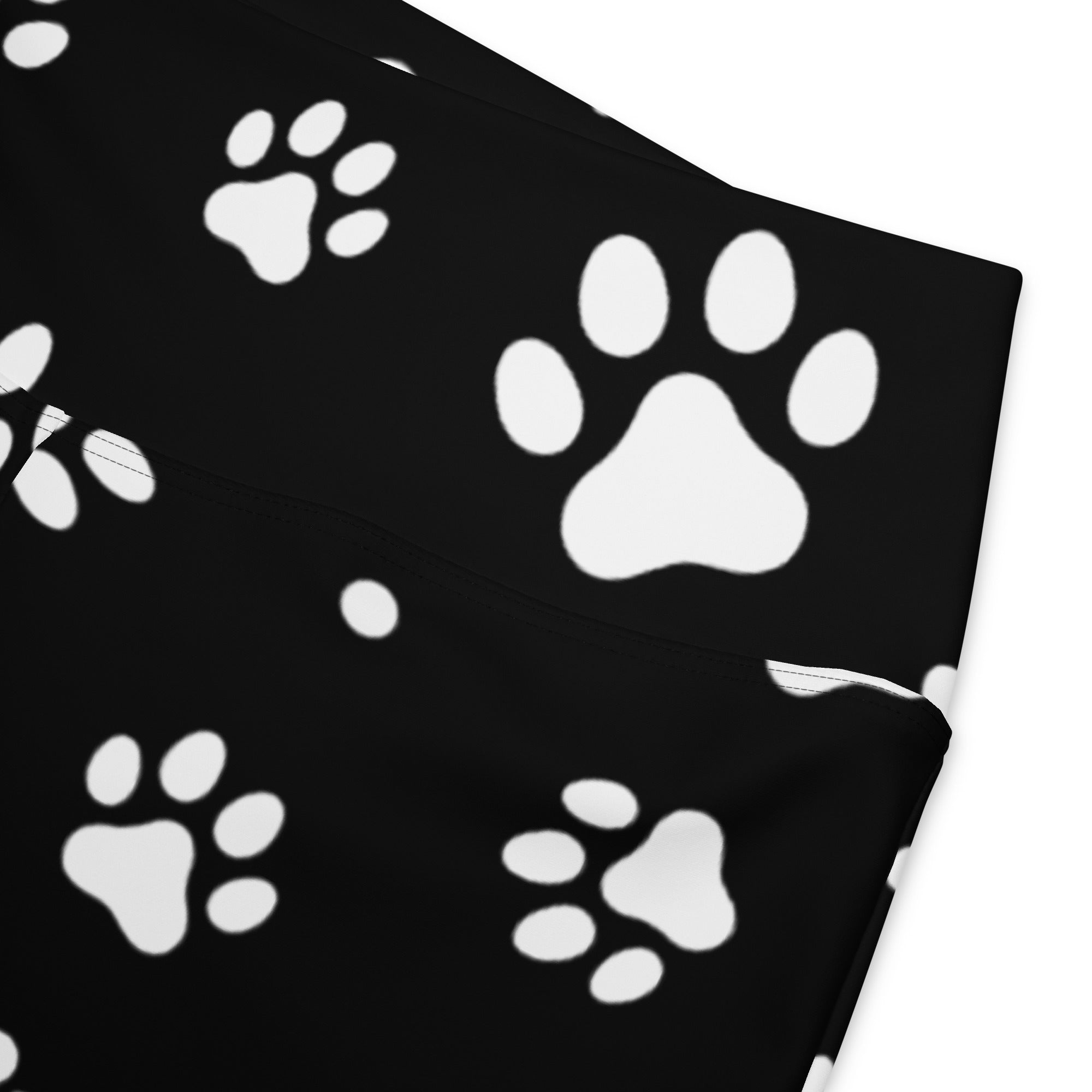 Black fabric headband with white paw print pattern complementing women’s black paw print high waist flare legging pants