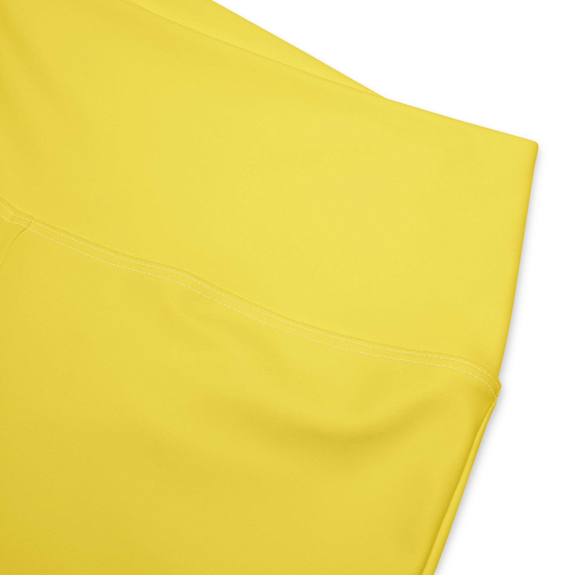 Bright yellow women’s high waist flare leggings made of smooth stretchy fabric for comfortable wear