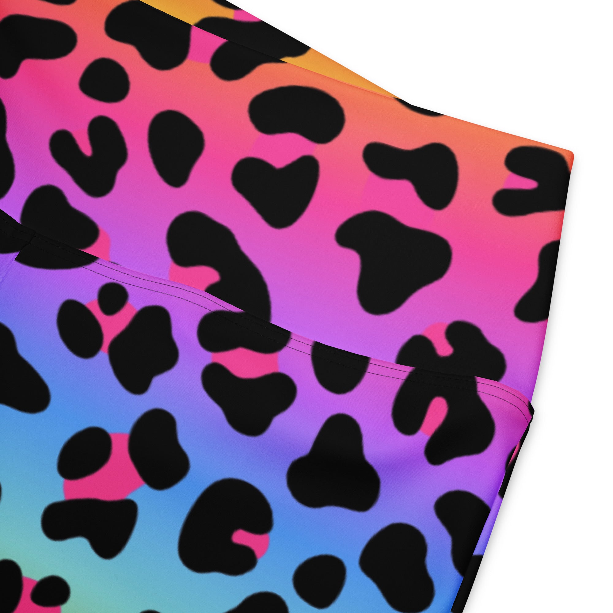 Women’s rainbow leopard high waist flare leggings with vibrant pink purple and blue gradient and black spots