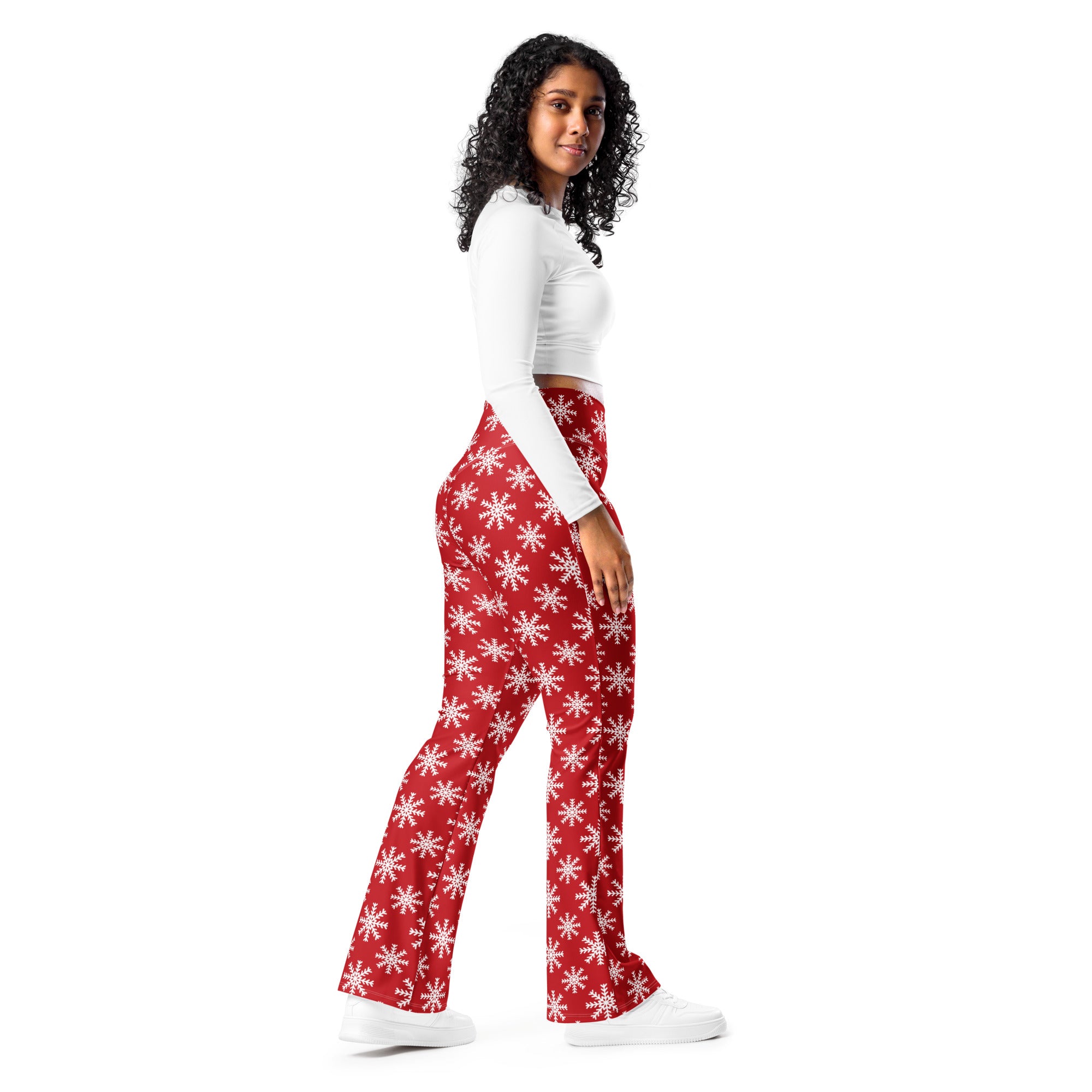 Women’s red high waist flare legging pants with white snowflake pattern perfect for winter wear