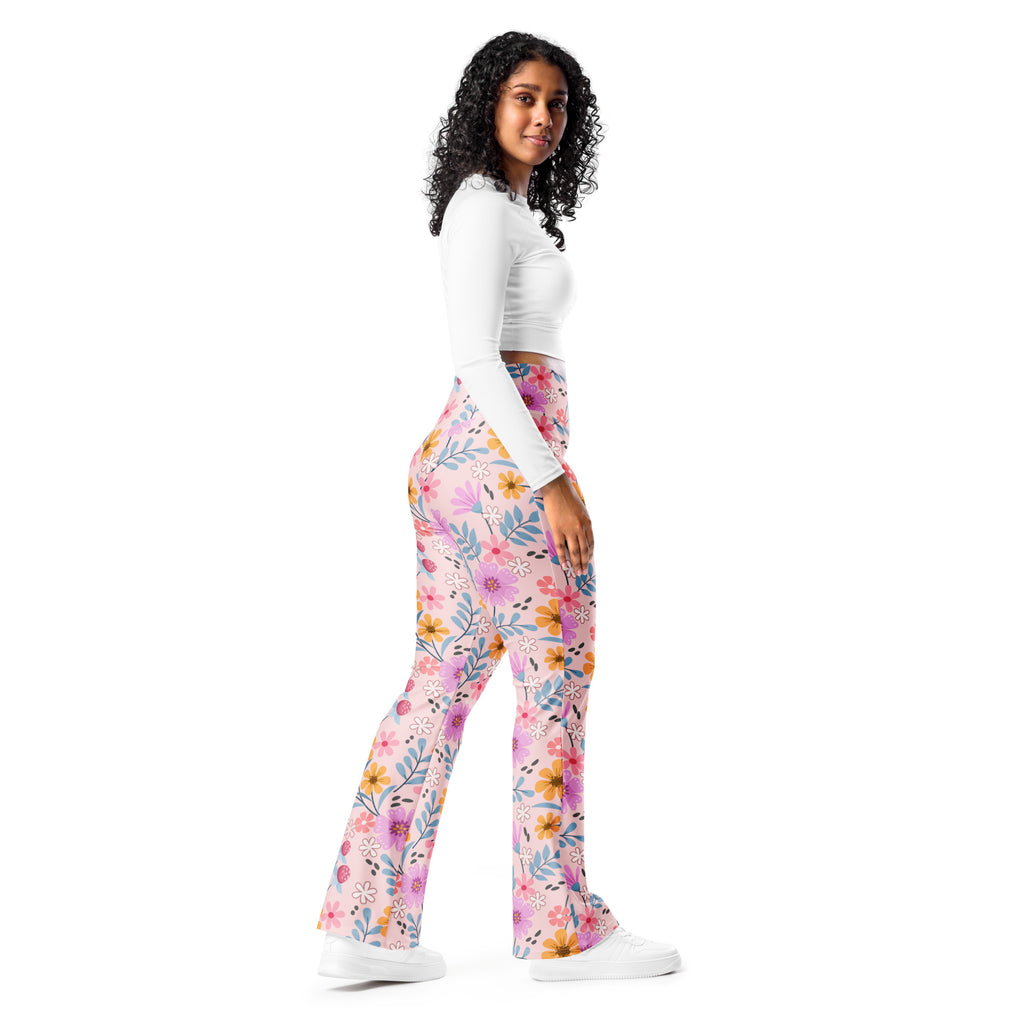 Women’s pink floral high waist flare legging pants featuring yellow orange and blue flower patterns