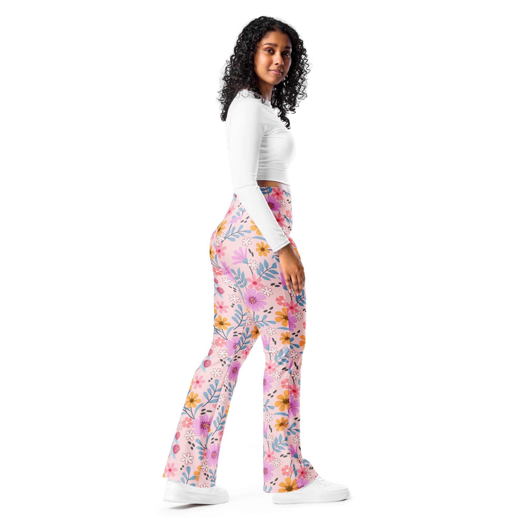 Women’s pink floral high waist flare legging pants featuring yellow orange and blue flower patterns