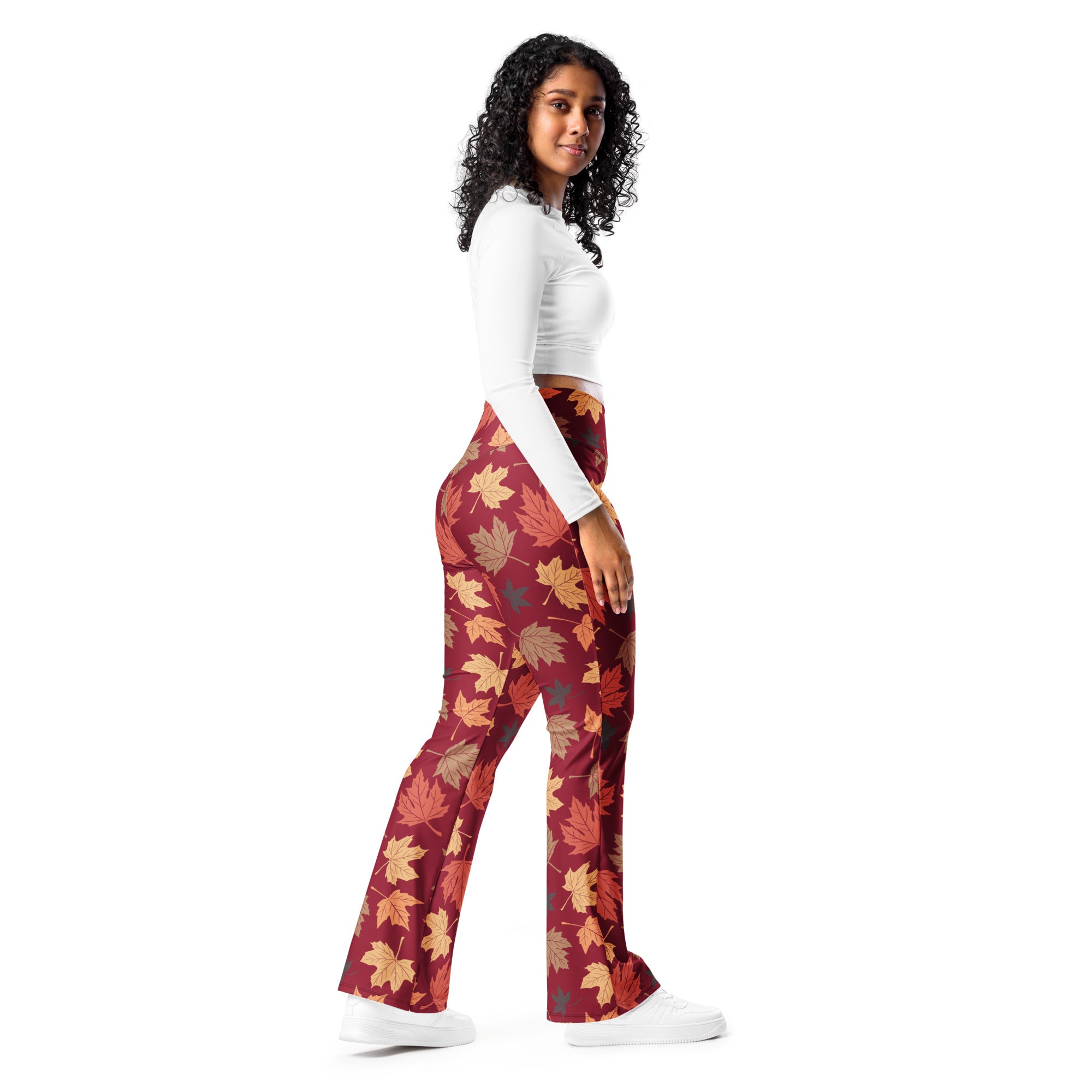 Women’s autumn leaves high waist flare legging pants in rich maroon fabric with all over autumn leaf pattern