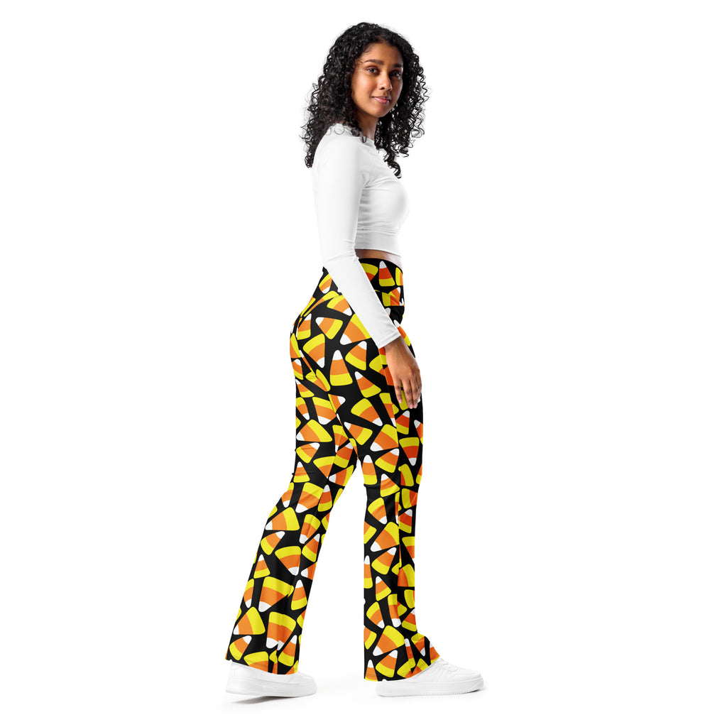 Women’s black high waist flare legging pants with candy corn pattern perfect for festive fall wear