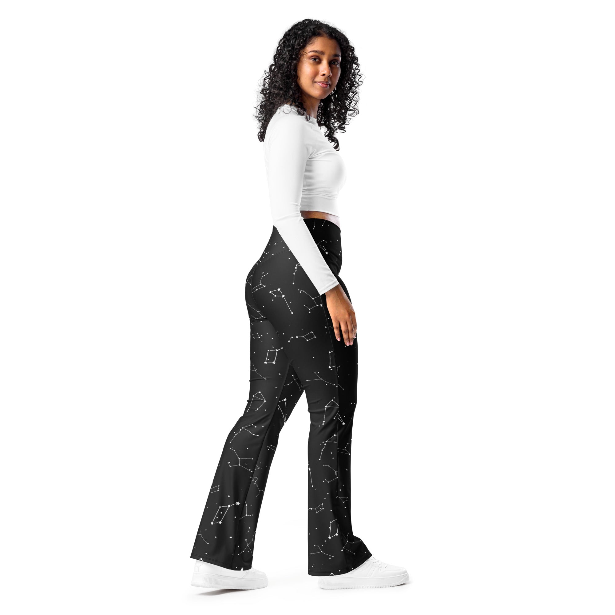 Black flare legging pants with a subtle white constellation pattern and high waist for women