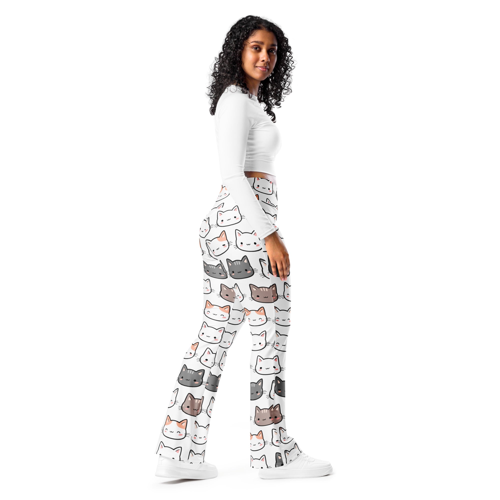 White cat-print high waist flare legging pants with a playful multicolor cartoon cat pattern on wide-leg fabric